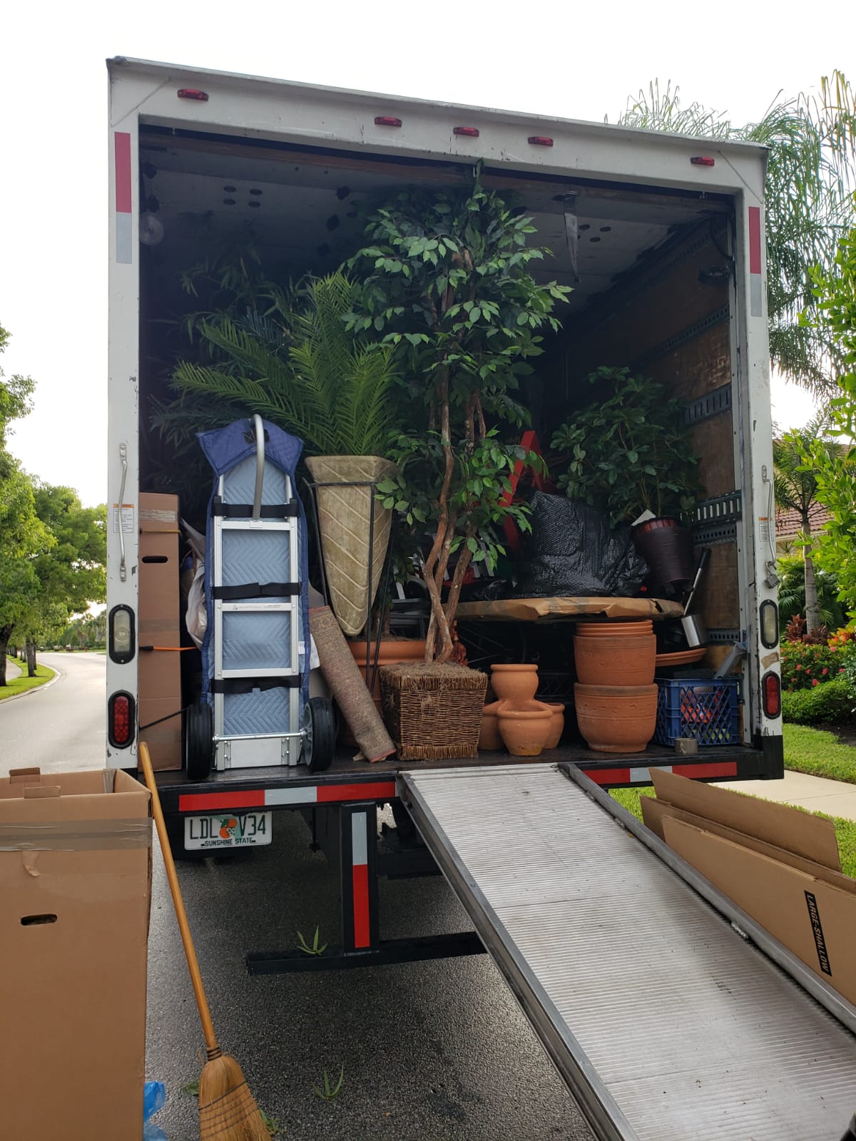 Professional movers loading furniture in Gulf Stream residence
