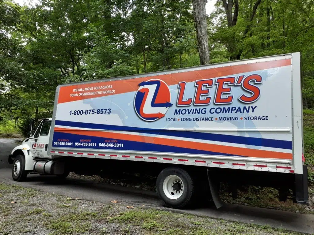Lee's Moving crew unloading furniture at a luxury estate, Delray Beach FL