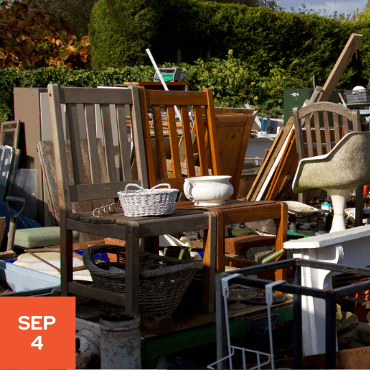 a group of chairs and tables in a yard