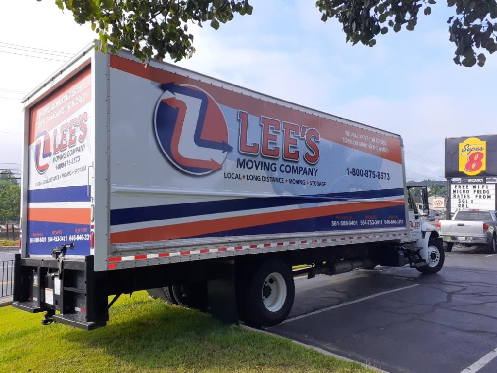 Lee's Moving Company crew standing in front of the moving truck, ready for a Davie move