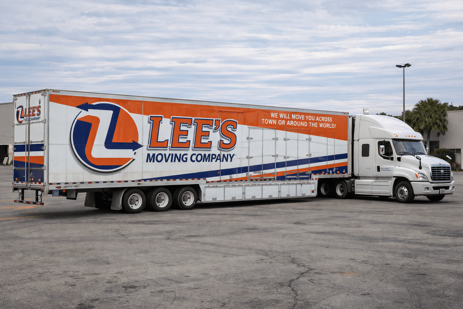 close-up of the side of a Lee's Moving Company truck showing the company name and DOT license number clearly painted on it